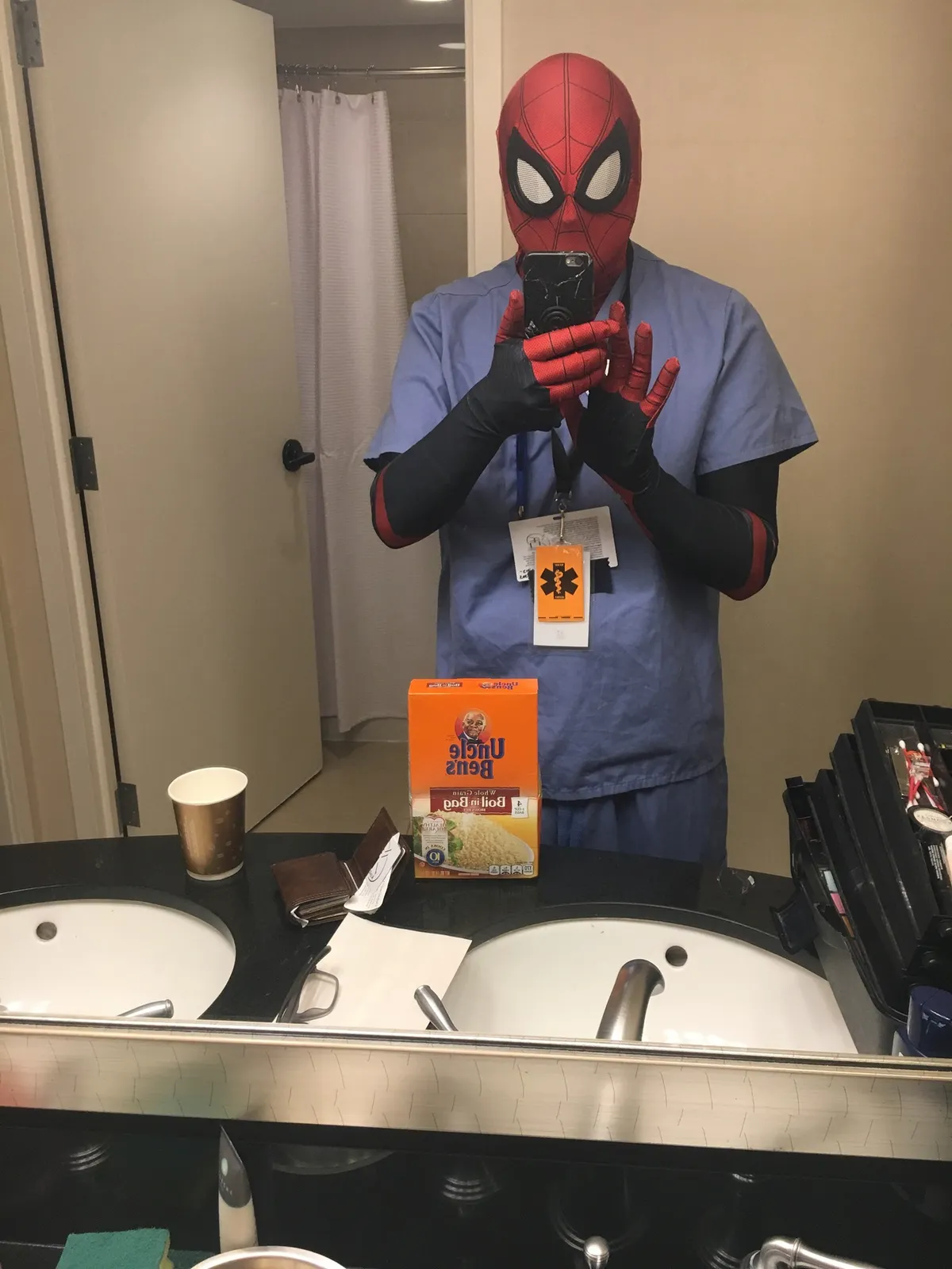 a man standing in front of a mirror posing for the camera: Jacob Capodanno, of Wilmington, cosplays as Dr. Spider-Man in his room in the Gaylord National Resort & Convention Center at Katsucon in Maryland in 2020.